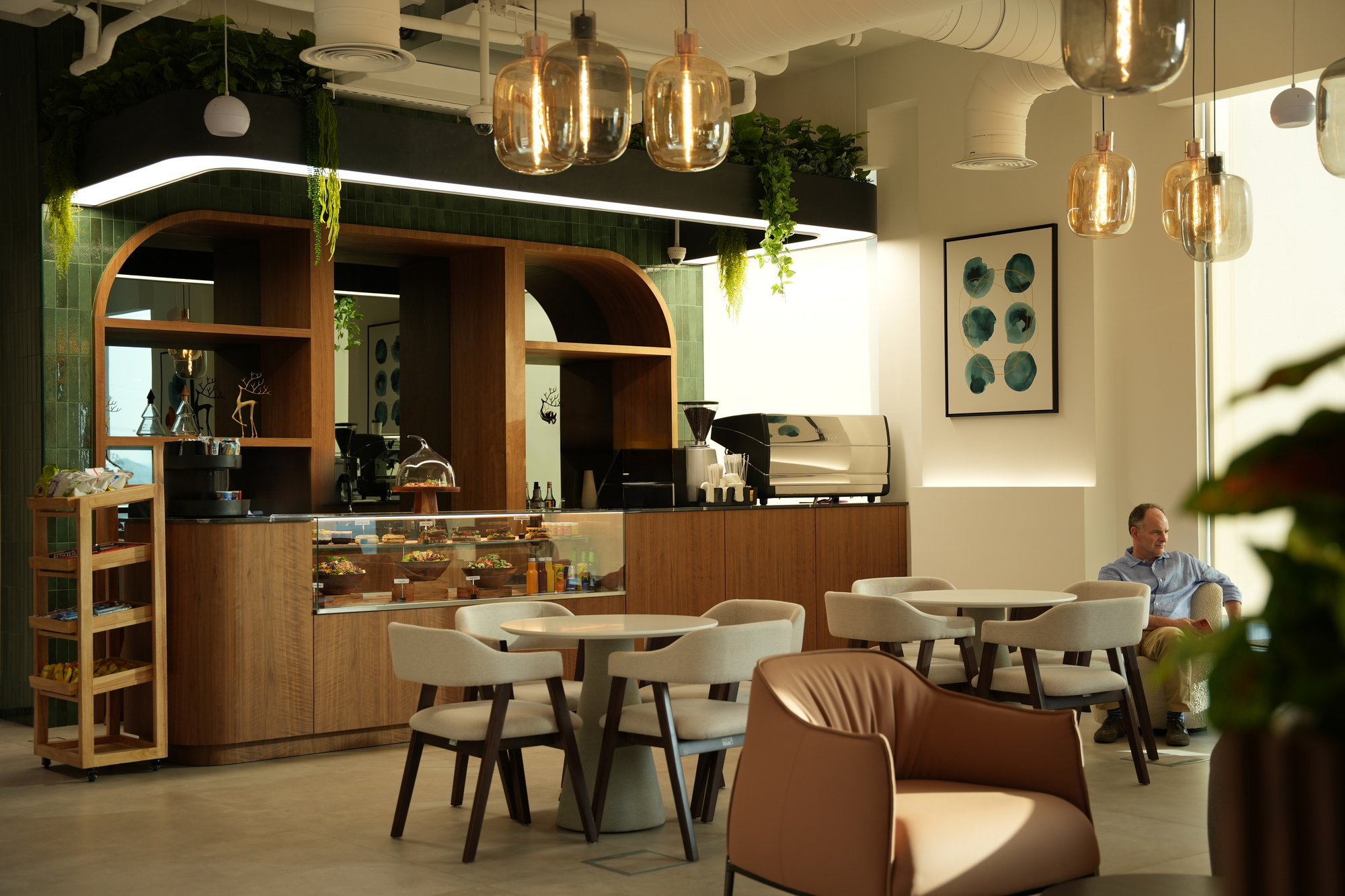 The café at flowork Dubai Hills, under hand-blown pendant lights