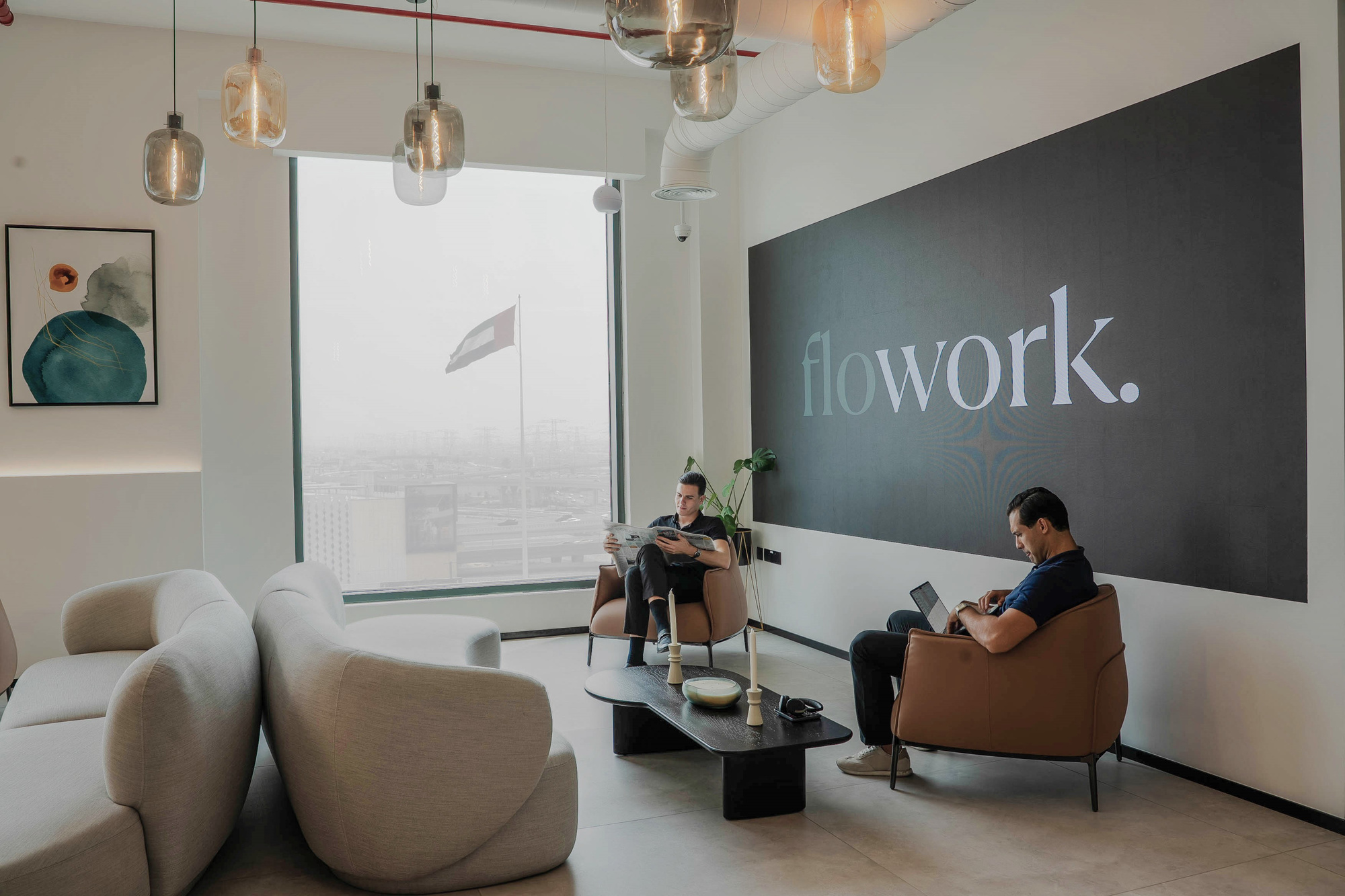 The flowork signage wall and lounge seating at Dubai Hills